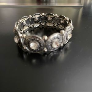 Stretchy Silvertone Bracelet with rhinestones on each link. D2-43